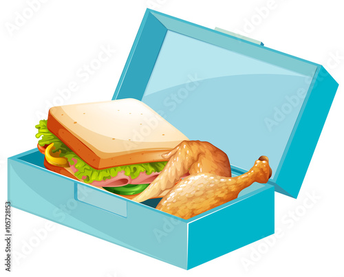 Lunch box with sandwiches and fried chicken