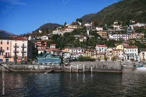 view from the water to the house on the shore of a mountain lake Como