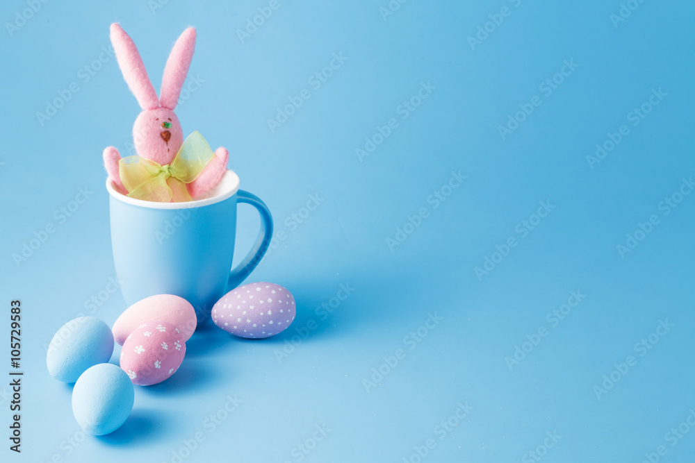 Candy color easter eggs with rabbit over mint