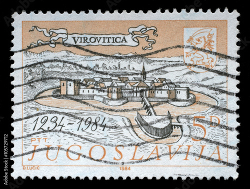 Stamp printed in Yugoslavia shows The 700th Anniversary of Virovitica, circa 1984. photo