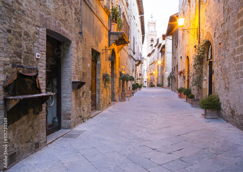 Fototapeta Naklejka Na Ścianę i Meble -  walls of alone street early in the morning  in Tuscany city in Italy