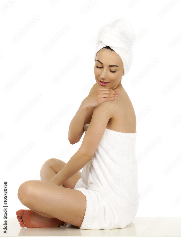 Young woman wrapped towel isolated on white background Young woman wrapped towel isolated on white background