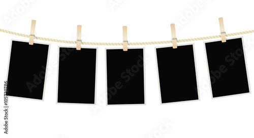 photo frames hanging on a rope with clothespins. vector