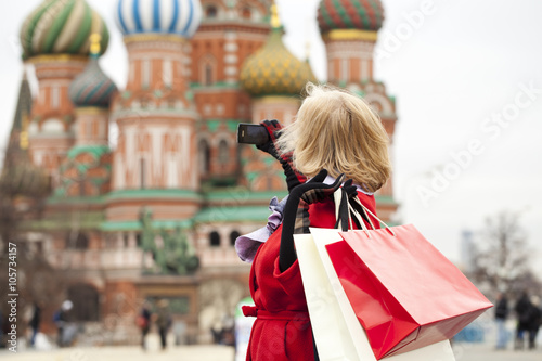 Mature happy woman with shopping bags