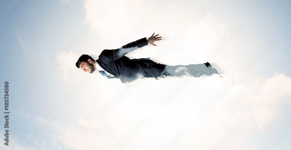 Business man flying like a superhero in clouds on the sky Business man flying like a superhero in clouds on the sky