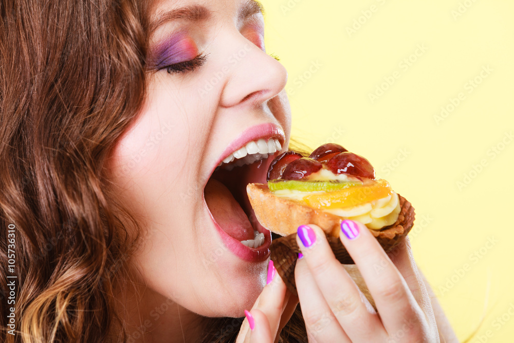 Closeup woman eating fruit cake sweet food Closeup woman eating fruit cake sweet food