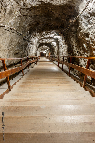 Wooden stairs going down into salt mine photo