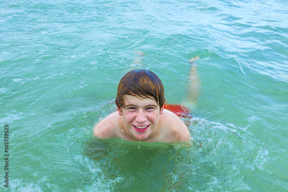 boy is swimming