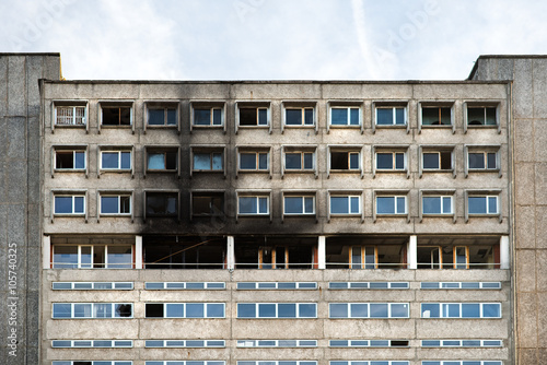 Фотография Facade of highrise house after an explosion and fire