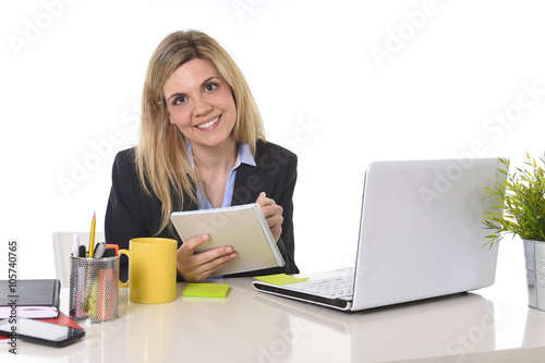 corporate portrait young happy Caucasian blond business woman working using digital tablet pad at office