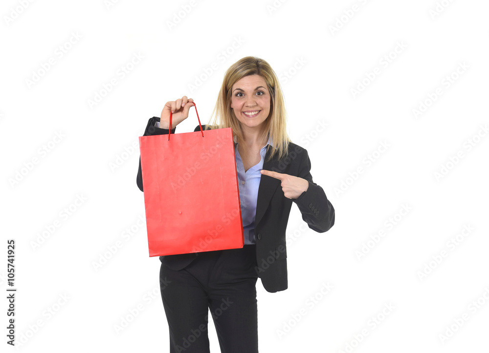 Fototapeta premium young happy beautiful woman in business suit in excited face expression holding red shopping bag