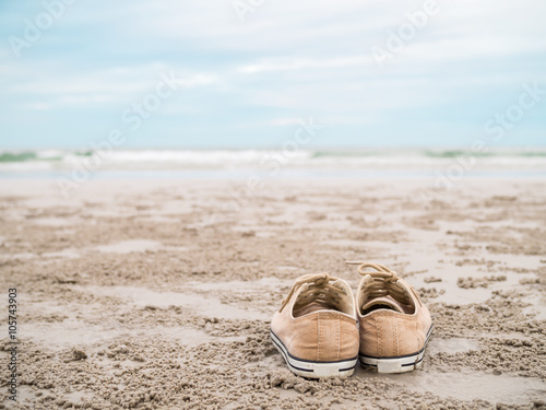 Canvas shoes on the beach