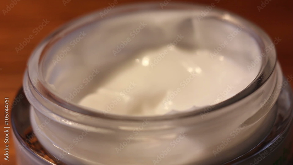 Feminine Hand Taking Skin Care Cream From the Jar Close up Feminine Hand Taking Skin Care Cream From the Jar Close up