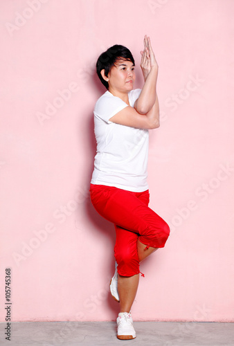 woman standing in the eagle pose