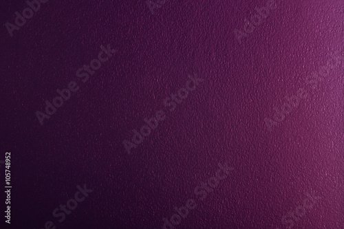 light shines on dark purple colored concrete wall