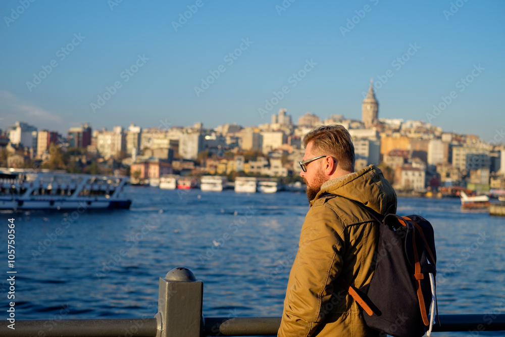  Young men traveler enjoying great view of the Bosphorus in Istanbul