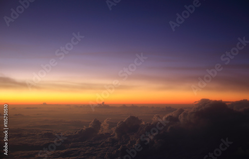 A pre-dawn sky above the clouds over Indonesia taking during a flight at 35,000ft.
