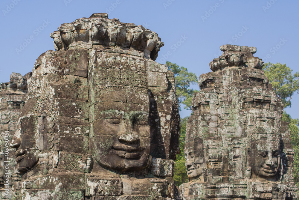 Stone head on towers of Bayon temple in Angkor Thom, Cambodia