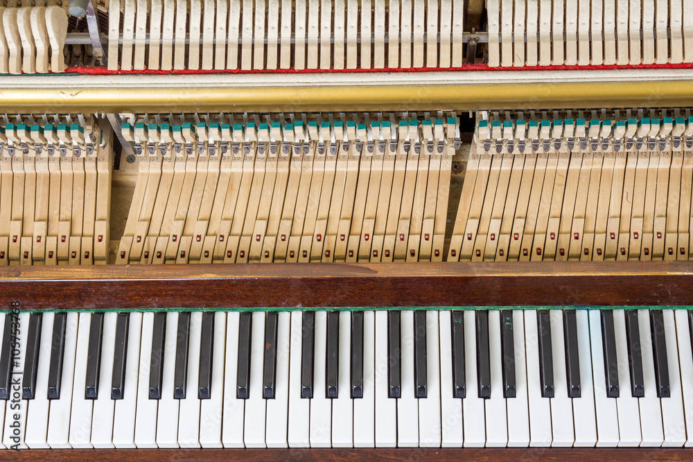 Keyboard and mechanics of an upright piano Keyboard and mechanics of an upright piano