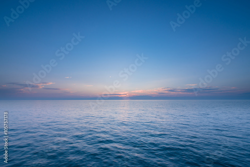 Beautiful sunset with blue sea and sky peaceful background long