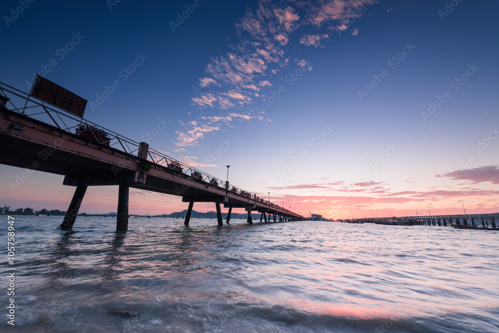 Bridge to the sea at sunrise, chalong harbor Phuket Thailand