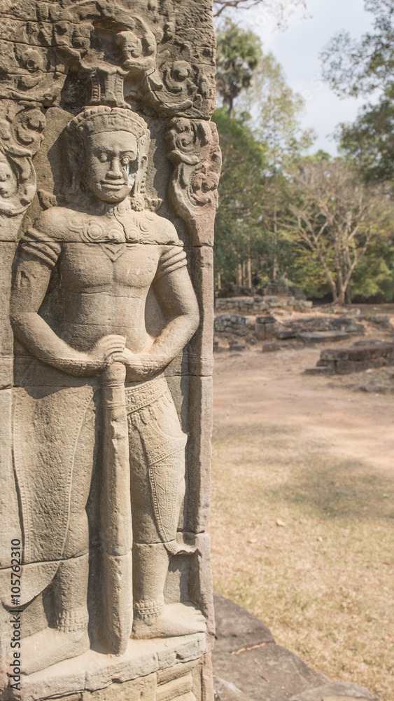Soldier with a massive club  guarding the entrance to the Banteay Kdei  Temple built by Jayavarman VII in the 12th Century, Cambodia.