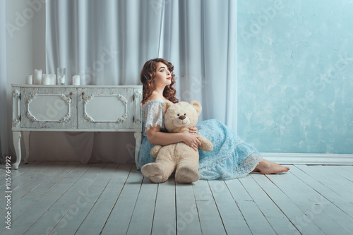 Obraz na plátně Woman with a toy bear.