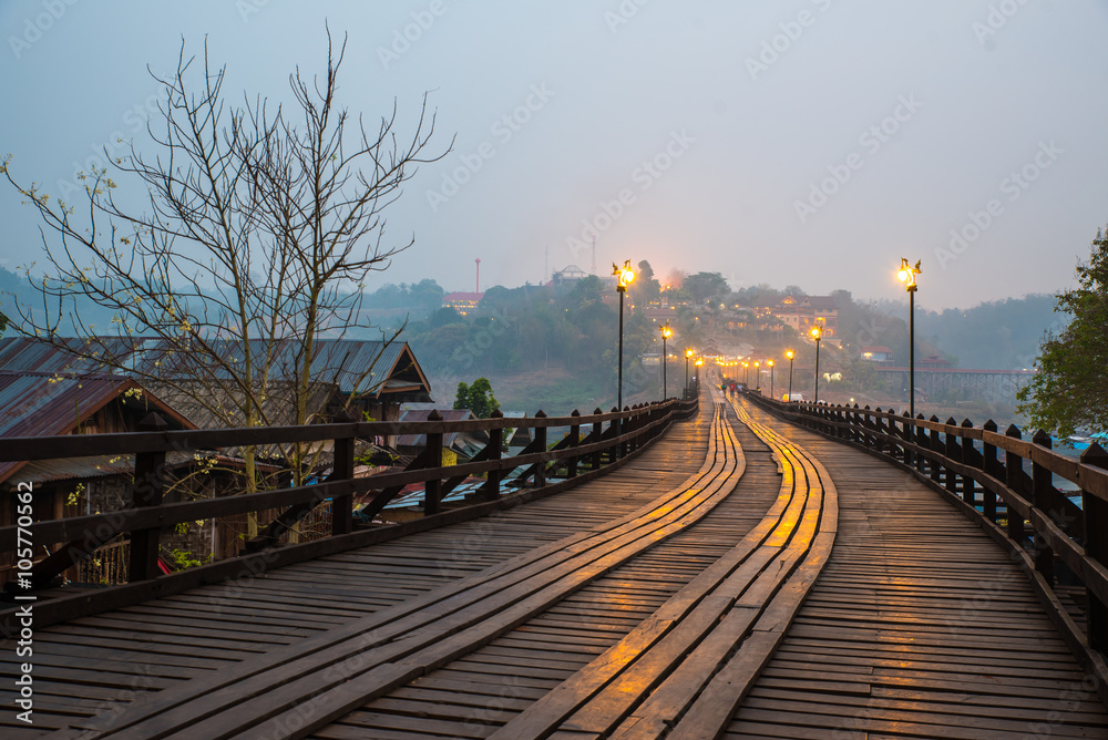 Mon bridge in Thailand under dawn.