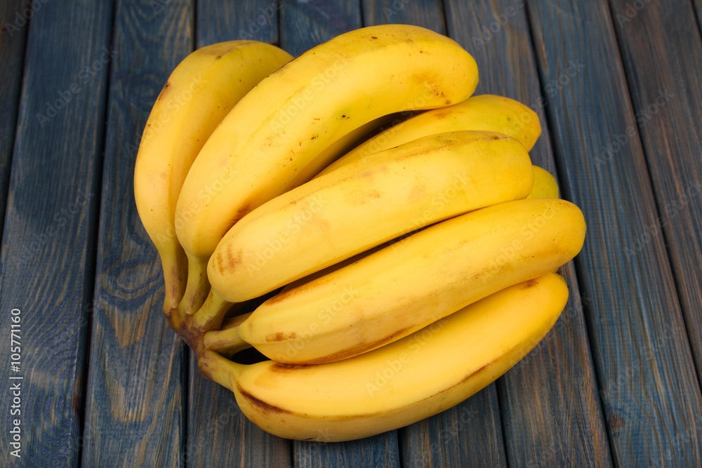 bananas on a wooden table bananas on a wooden table