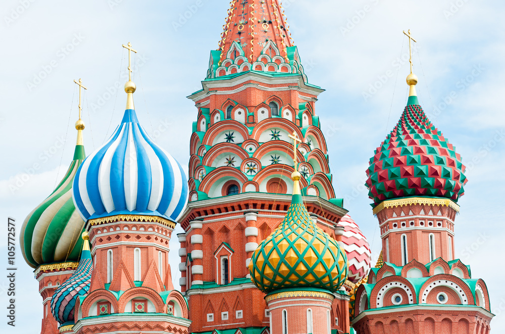 Domes of Saint Basil's Cathedral against blue sky with white clouds, Red square, Moscow, Russia