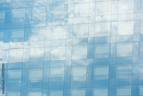 blue sky and clouds reflected in office building