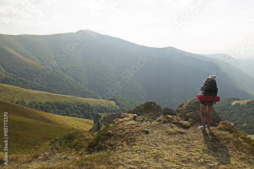 Girl taking photo in mountains