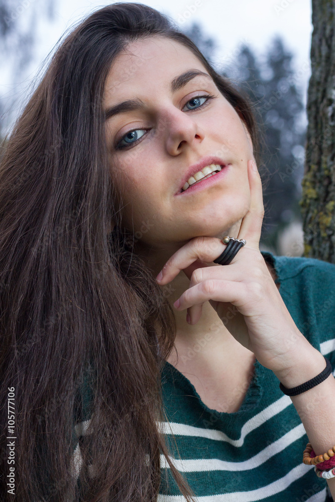 Blue-eyed young model posing in a fashion shoot in the park. Blue-eyed young model posing in a fashion shoot in the park.