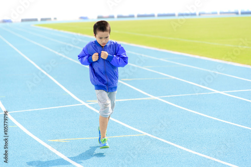Boy run in blue track