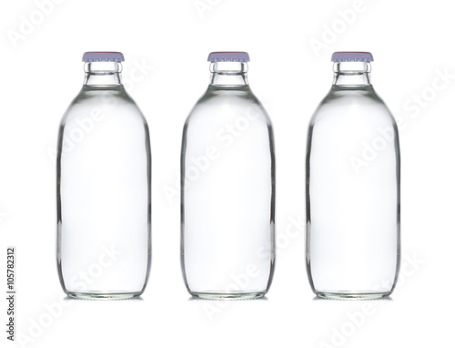 three small glass water bottle