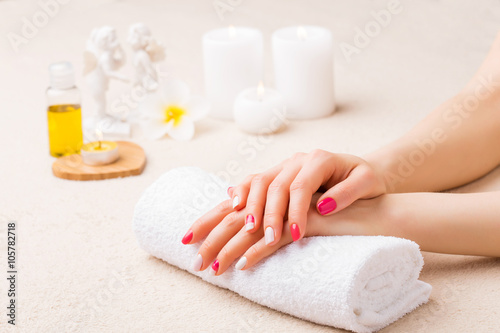 Woman is spa salon with her nails done