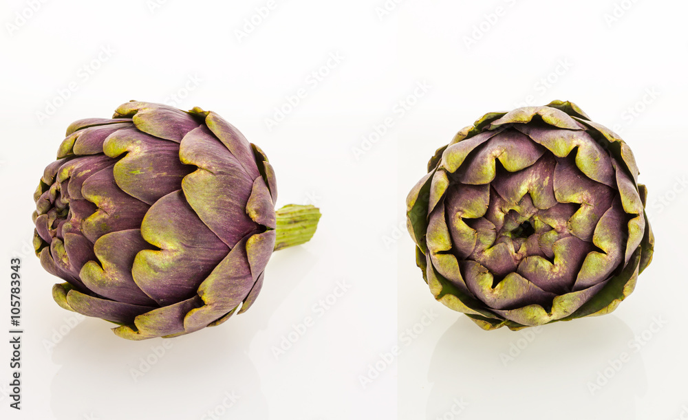 Fototapeta premium Two fresh purple artichokes, isolated on white background.