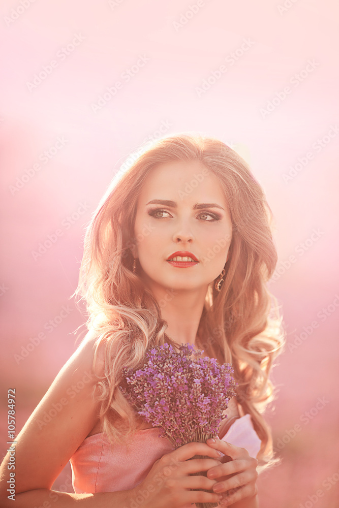 Beautiful young woman in the lavender fields Beautiful young woman in the lavender fields