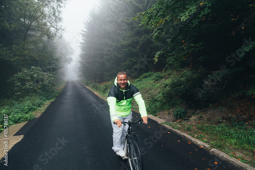 Man riding a mountain bicycle on the road