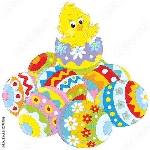 Little yellow chick hatched from a painted Easter egg