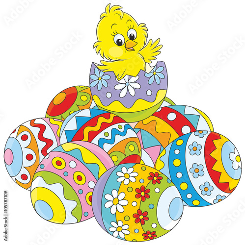 Little yellow chick hatched from a painted Easter egg