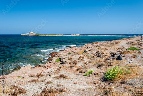The coastline near Portopalo (Sicily), and the island of Capo Passero in the background