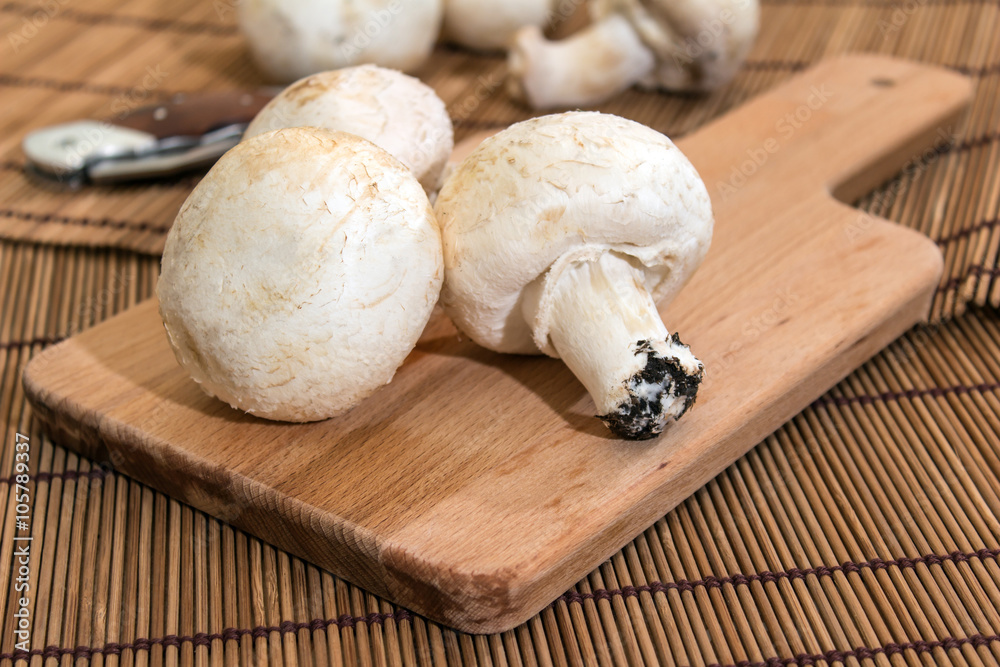 Champignon on a chopping board Champignon on a chopping board