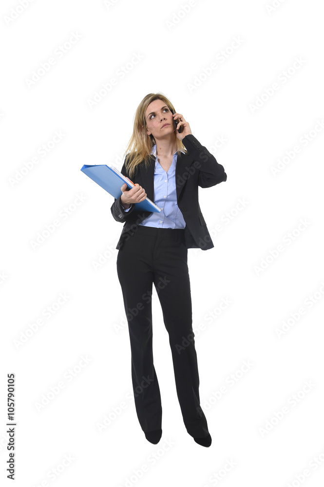 businesswoman talking on mobile phone holding office folder and pen looking busy and worried businesswoman talking on mobile phone holding office folder and pen looking busy and worried
