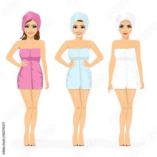 three young women with body and hair wrapped in pink, blue and white towels