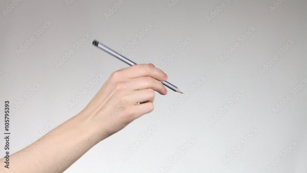 Hand writes pencil in the air. Hand writes pencil in the air.