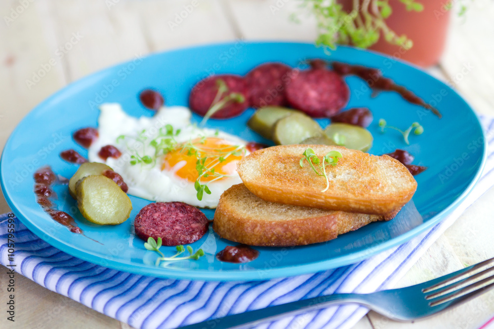 Eggs with sausages and toasts for breakfast Eggs with sausages and toasts for breakfast