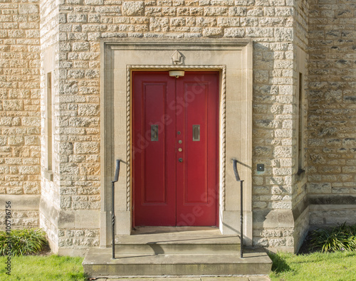 Red door with crest above