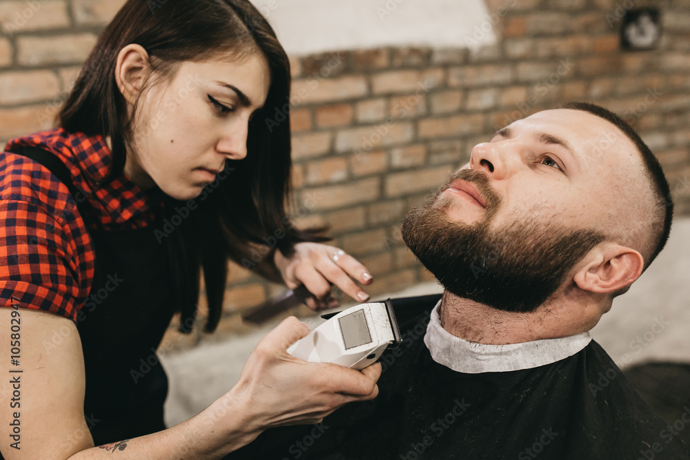 Bearded hipster client visiting barber shop Bearded hipster client visiting barber shop