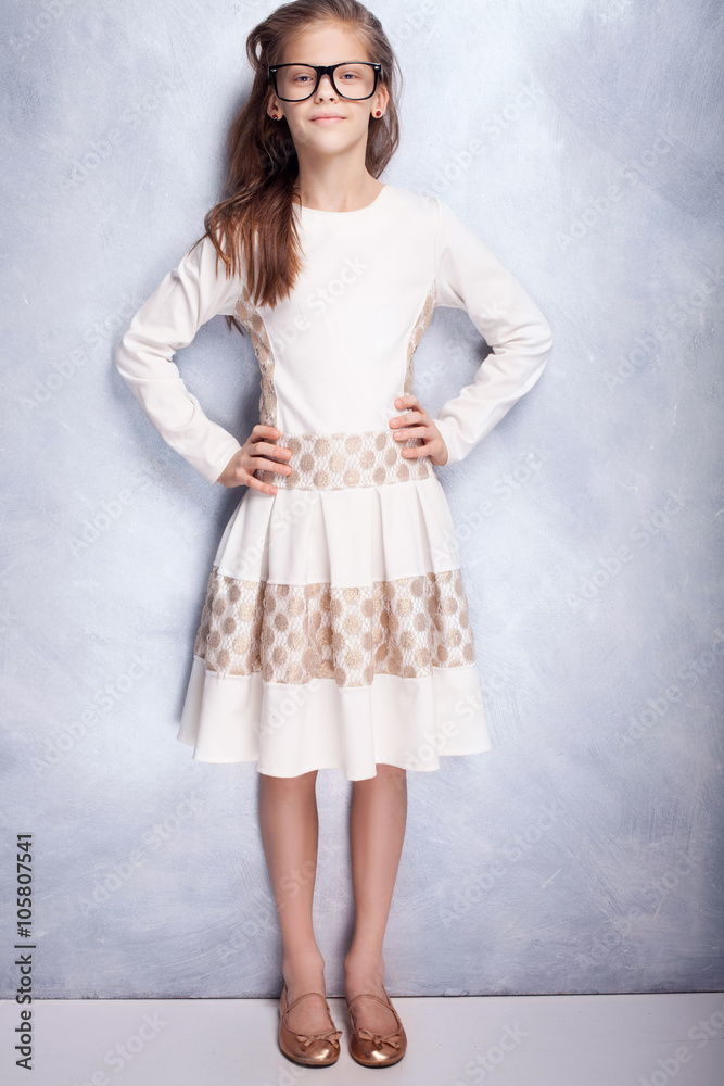 Cute young girl posing in studio. Cute young girl posing in studio.
